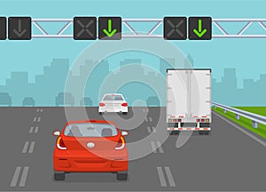 Driving a car. Traffic flow on a highway with lane control lights. Safe driving and traffic regulation rules.