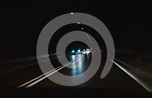 Driving a car through a tunnel in the dark