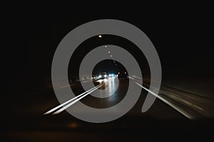 Driving a car through a tunnel in the dark