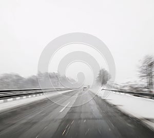 Driving a car in winter highway