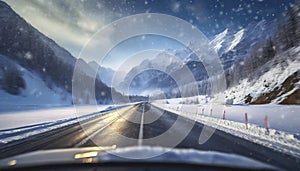 Driving a car on a winter road through snow covered mountains.