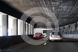Driving through concrete tunnels on New York City\'s FDR Drive