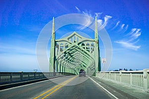 Driving on the Conde B. McCullough Memorial Bridge, Oregon, formerly the Coos Bay Bridge, on a sunny day