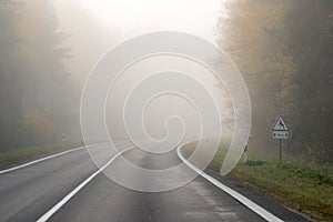 Driving on countryside road in fog. Illustration of dangers of d