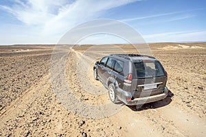 Driving on dirt road through Sahara desert, Morocco