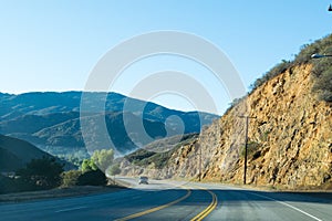 Driving down foggy highway in Malibu Creek State Park