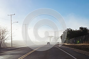 Driving down foggy highway in Malibu Creek State Park