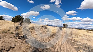 Driving dry arid desert hill trail follow UTV POV 4K