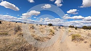 Driving dry arid desert trail trail fast motion POV 4K