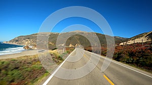 Driving on the edge in scenic Big Sur California Cabrillo Highway 1 coast road, pov back south