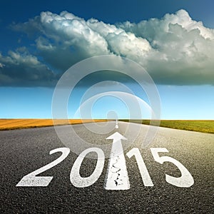 Driving on an empty asphalt road forward to new 2015