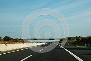 Driving on empty highway asphalt road and beautiful sky in summer day landscape