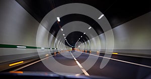 Driving fast in a tunnel on the highway