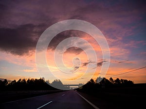 Driving on german autobahn on a beautiful sunset