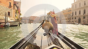 Driving with the Gondola through a small Venezian canal.