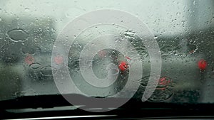 Driving in heavy rainy and slippery road in raining season. Abstract blurred background while raining snap vdo inside car to see