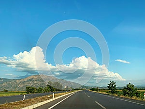 Driving highway on blue sky background