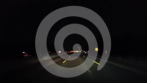 Driving Highway During the Evening.  Driver Point of View POV Interstate Drive at Night.  Freeway or Motorway or Turnpike