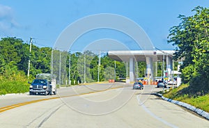 Driving on highway freeway motorway thru toll booth house Mexico photo