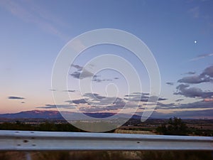 Driving highway mountain road in Greece at sunset