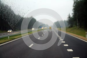 Driving on a highway in a rainy day