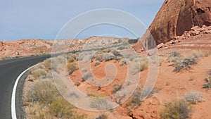 Driving On Highway In Sand Hot Desert With Red Orange Rock Formations Canyon