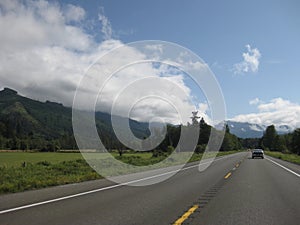 Driving Highway in Washington State, Partly Cloudy