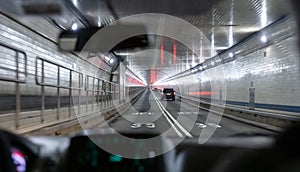 Lincoln tunnel, New York. View from the interior of a car. Speed limit 35mph on the asphalt