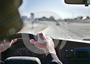 Driving on Los Angeles California freeways in mild traffic with a dirty windshield.