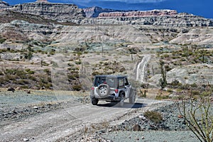 Jeep car in baja california landscape panorama desert road