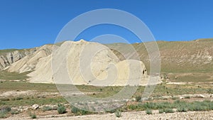 Driving through mountain and rocky landscape.