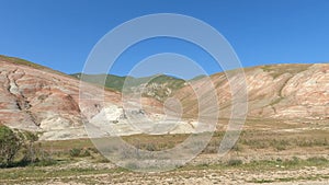 Driving through mountain and rocky landscape.