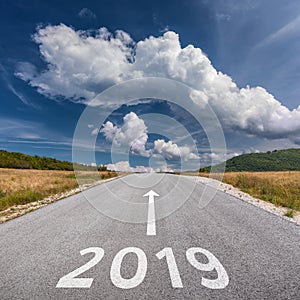 Driving on open road towards the 2019 at sunny day