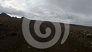 Driving Plate Front View POV Gravel Road Iceland F-Road Offroad Dirt on Cloudy Rainy Day
