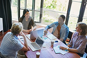 Driving productivity with efficient teamwork. Shot of a diverse group of businesspeople having a meeting in a modern