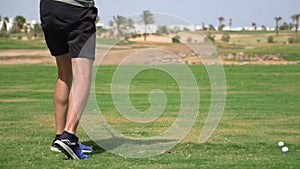 Driving Range Golf. Man practicing with golf club. Slow motion