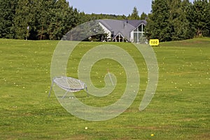 Driving range ongolf course on a green golf course.