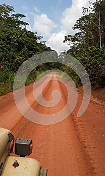 Driving on red dirt road N17 between Kribi and Ebolowa, Cameroon, Africa