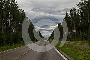 Driving on the 855 road during the midnight sun