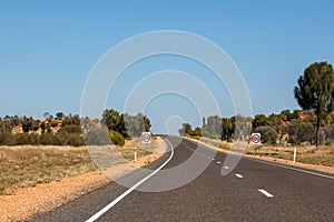 Driving on a road to Yulara, Ayers Rock, Red Center, Australia