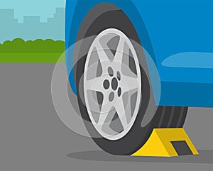 Driving rules and tips. Close-up view of wheel stopper or chocks.