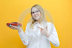 Driving school idea and concept, student driver passed the exam, drivers license, portrait of a beautiful happy young woman,