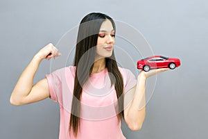 Driving school idea and concept, student driver passed the exam, drivers license, portrait of a beautiful happy young woman,