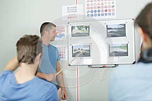 driving school teacher at class