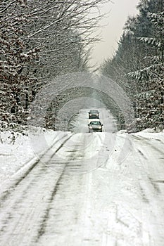 Driving in the snow on a countryroad photo