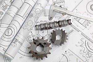 Driving sprockets, chain and engineering drawings photo