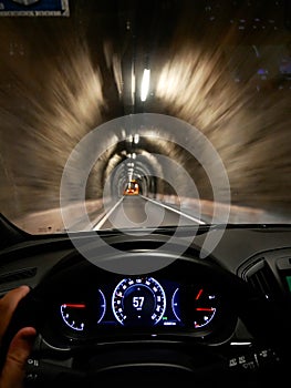 Driving thru a narrow tunnel seen from driver perspective