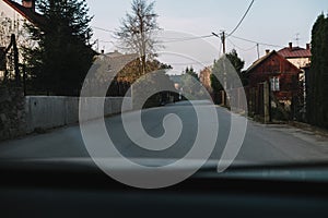 Driving through the town or village, view from the car