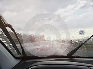 Driving under the rain in the front windmill