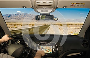 Driving using GPS on a desert road, Death Valley, USA